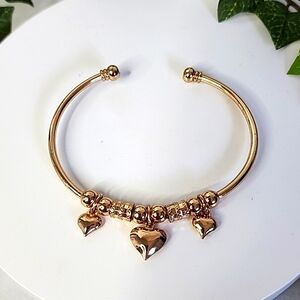 Gold Steel Open Cuff Bracelet with Heart Charms